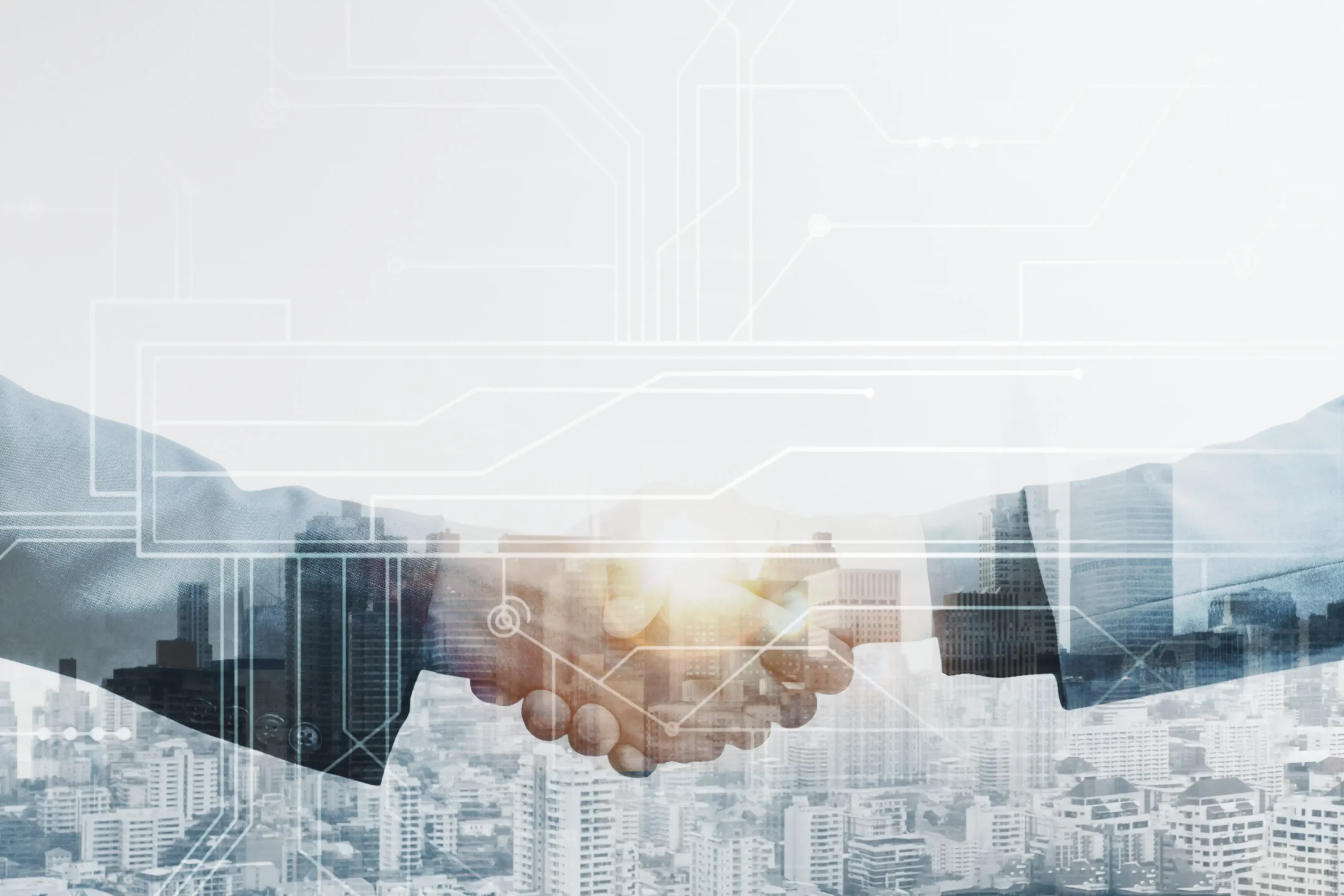 Handshake over a city skyline with a circuit overlay